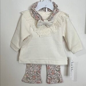 Nicole Miller Cream Baby Top/ Pants/Headband set with Lace Collar
Size: 3/6 M